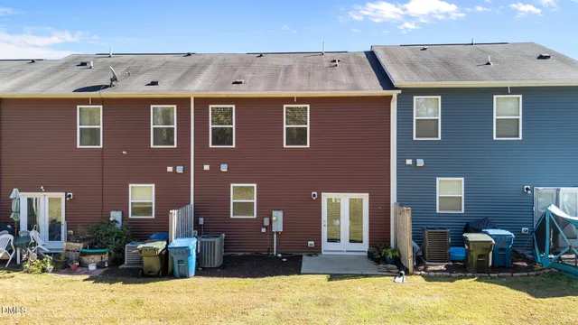 a front view of a building with a yard