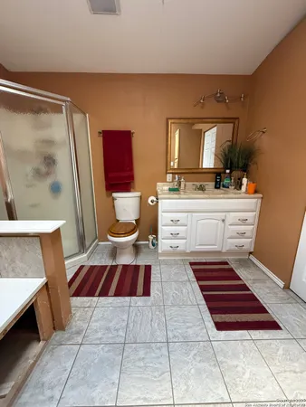 a living room with a furniture and a rug