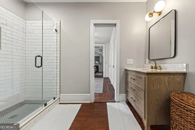 a bedroom with a bed and a television