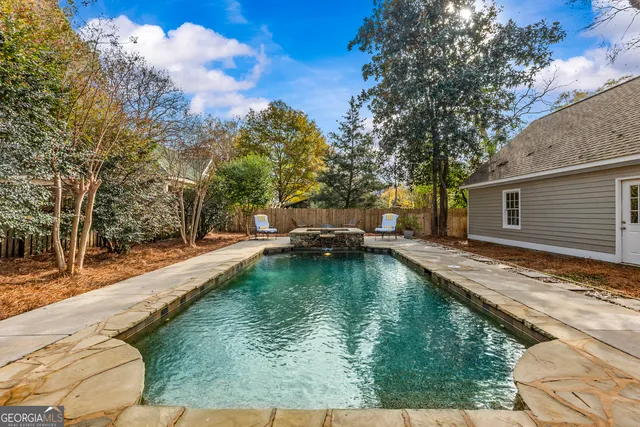 a view of a backyard with sitting area