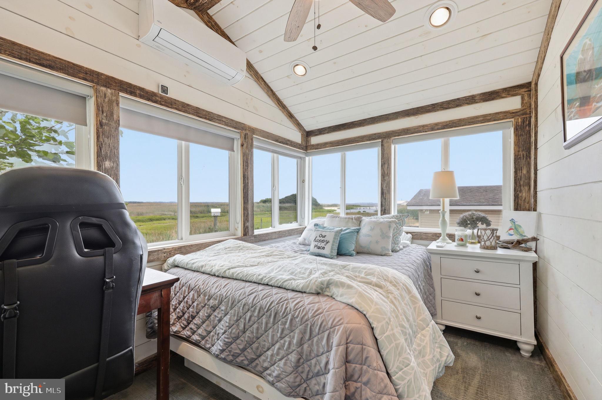 173 Cove Road Newport, NJ 08345 - Photo 26 of 72 a bedroom with a bed and large windows