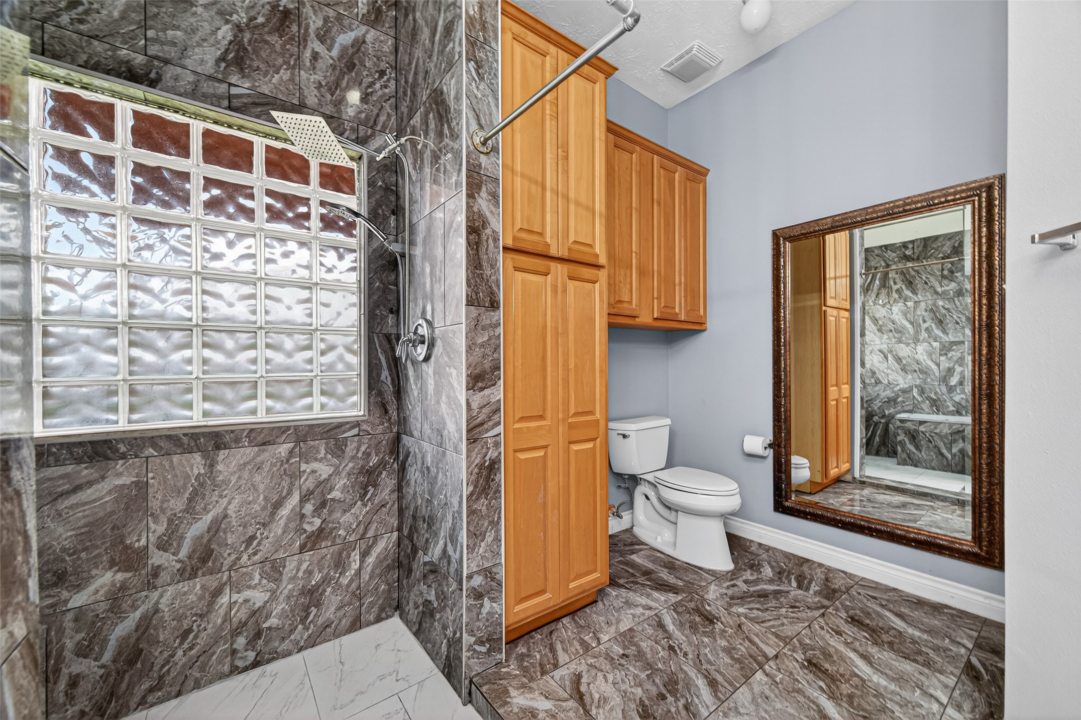23914 Glengate Drive Spring, TX 77373 - Photo 25 of 49 a bathroom with a toilet sink and shower