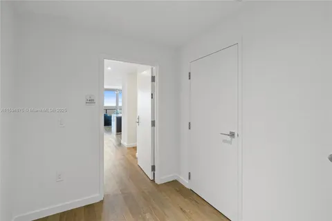 a kitchen with a sink and stainless steel appliances