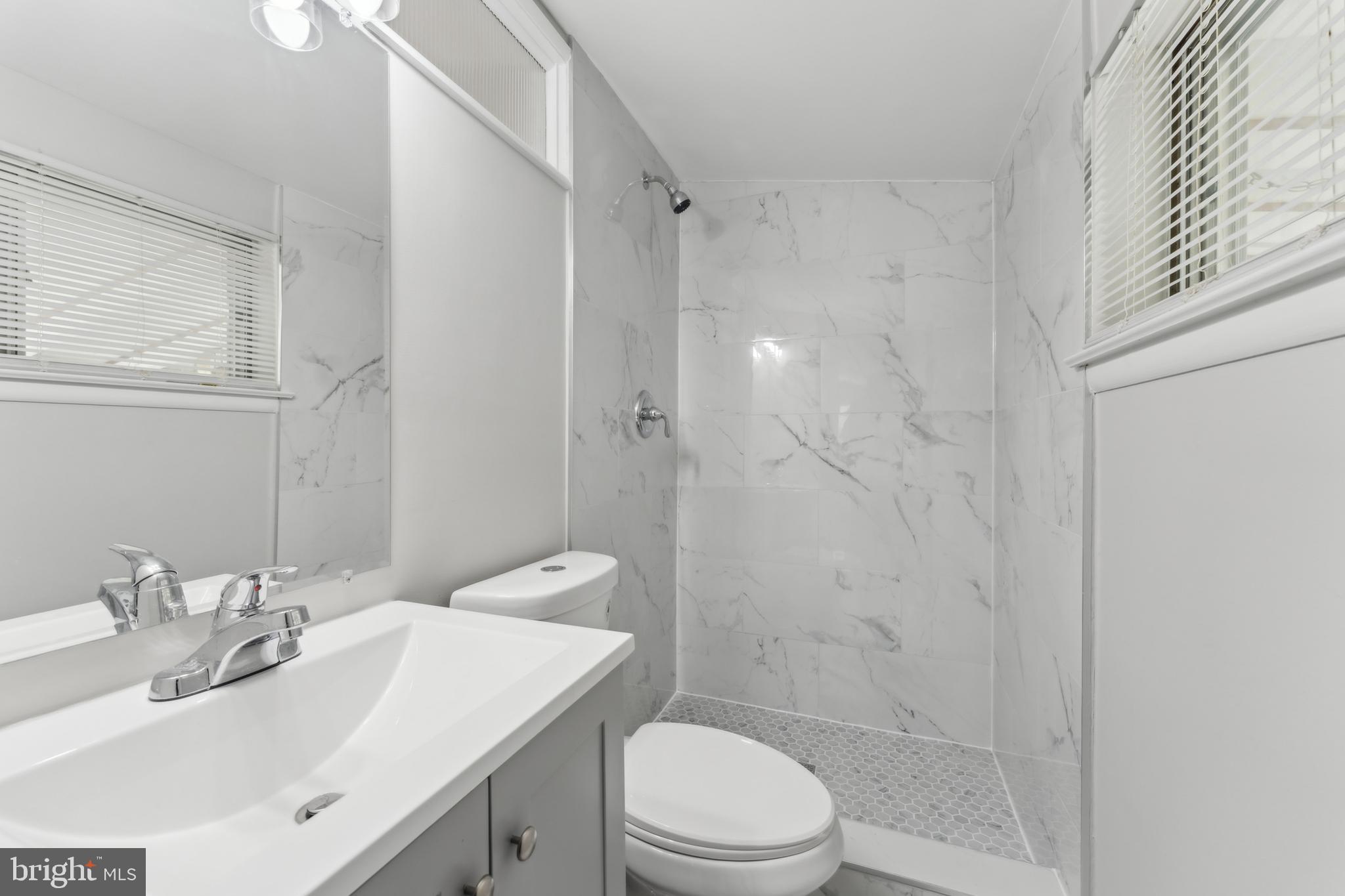 600 Sisson Street Silver Spring, MD 20902 - Photo 17 of 28 a bathroom with a sink toilet and shower