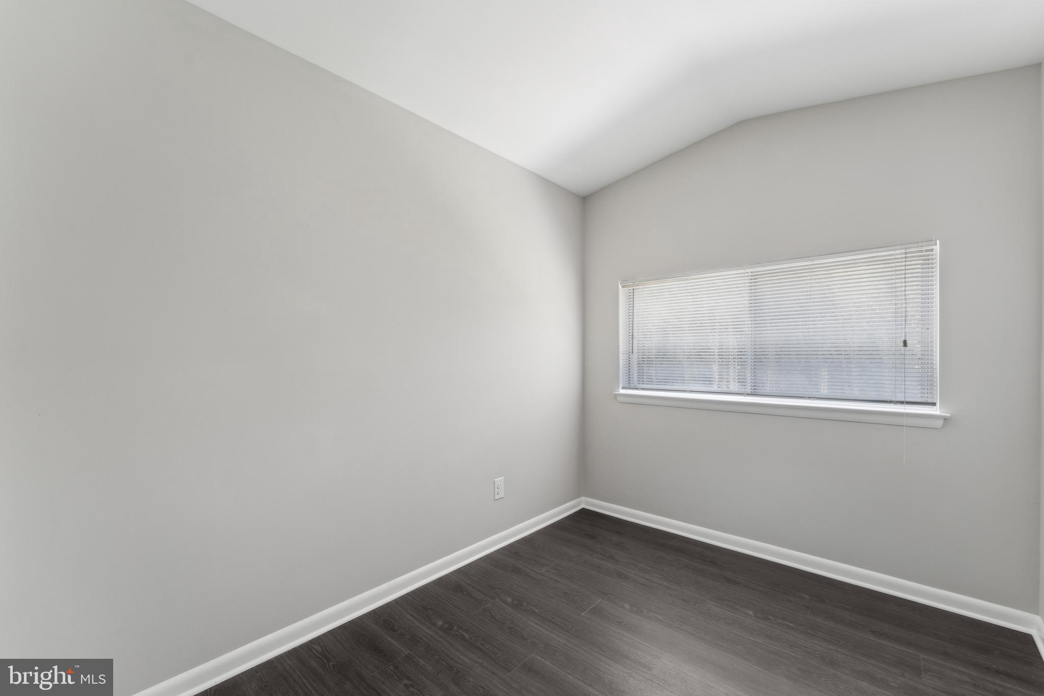 600 Sisson Street Silver Spring, MD 20902 - Photo 18 of 28 a view of an empty room with wooden floor and a window