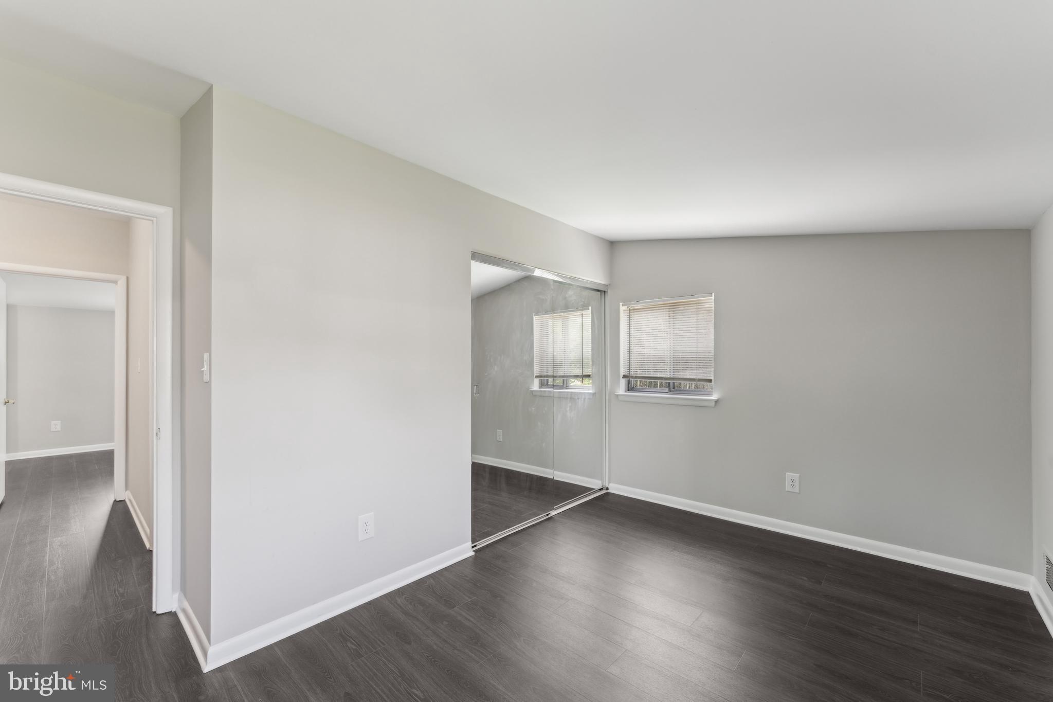 600 Sisson Street Silver Spring, MD 20902 - Photo 19 of 28 an empty room with wooden floor & windows