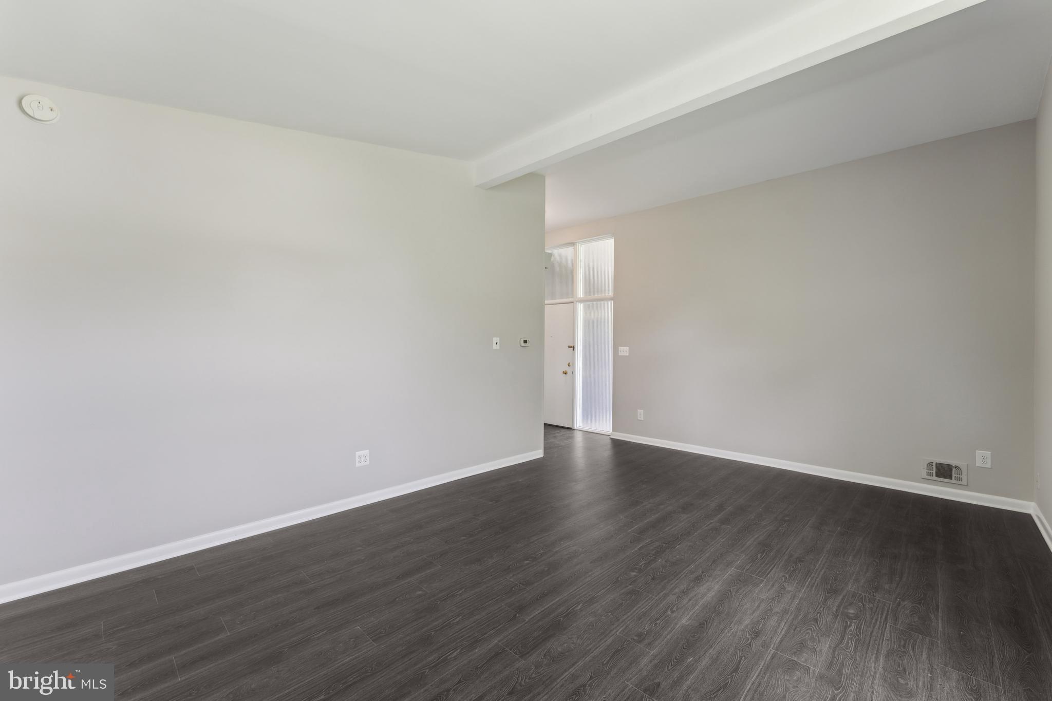600 Sisson Street Silver Spring, MD 20902 - Photo 6 of 28 a view of an empty room with wooden floor