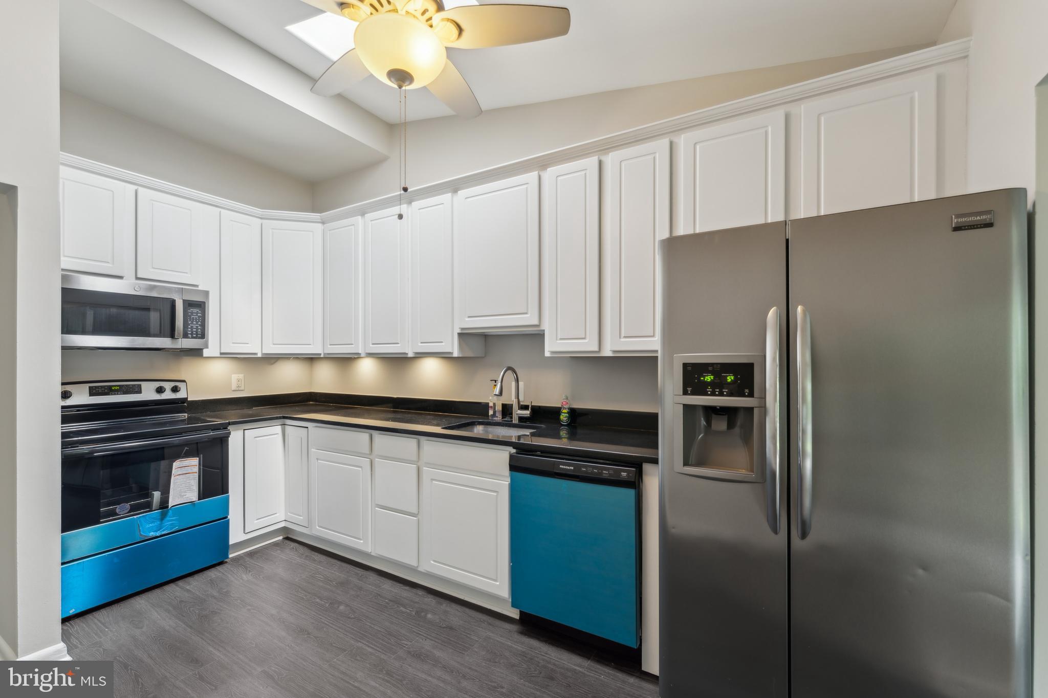 600 Sisson Street Silver Spring, MD 20902 - Photo 10 of 28 a kitchen with a refrigerator and a sink