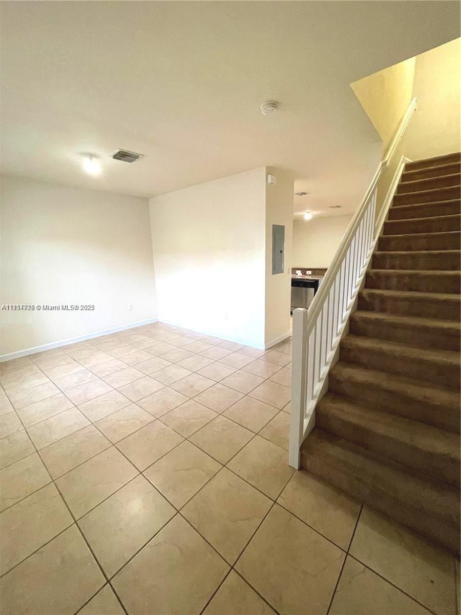 3217 Southeast 4th Street Homestead, FL 33033 - Photo 13 of 20 a view of an empty room and stairs