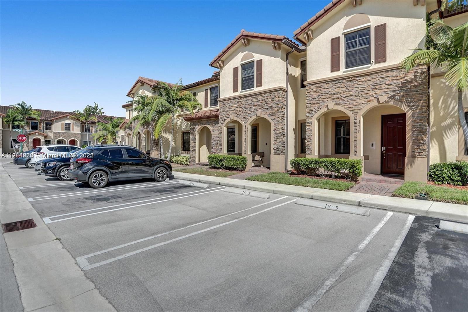 3217 Southeast 4th Street Homestead, FL 33033 - Photo 3 of 20 a view of a car parked in front of a houses