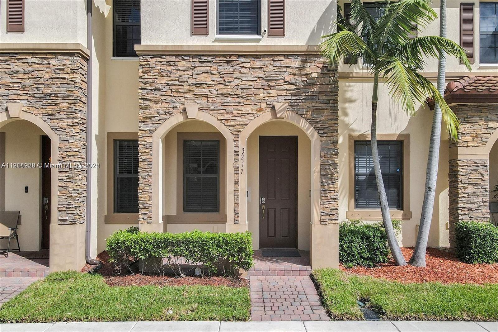 3217 Southeast 4th Street Homestead, FL 33033 - Photo 5 of 20 front view of a house with potted plants