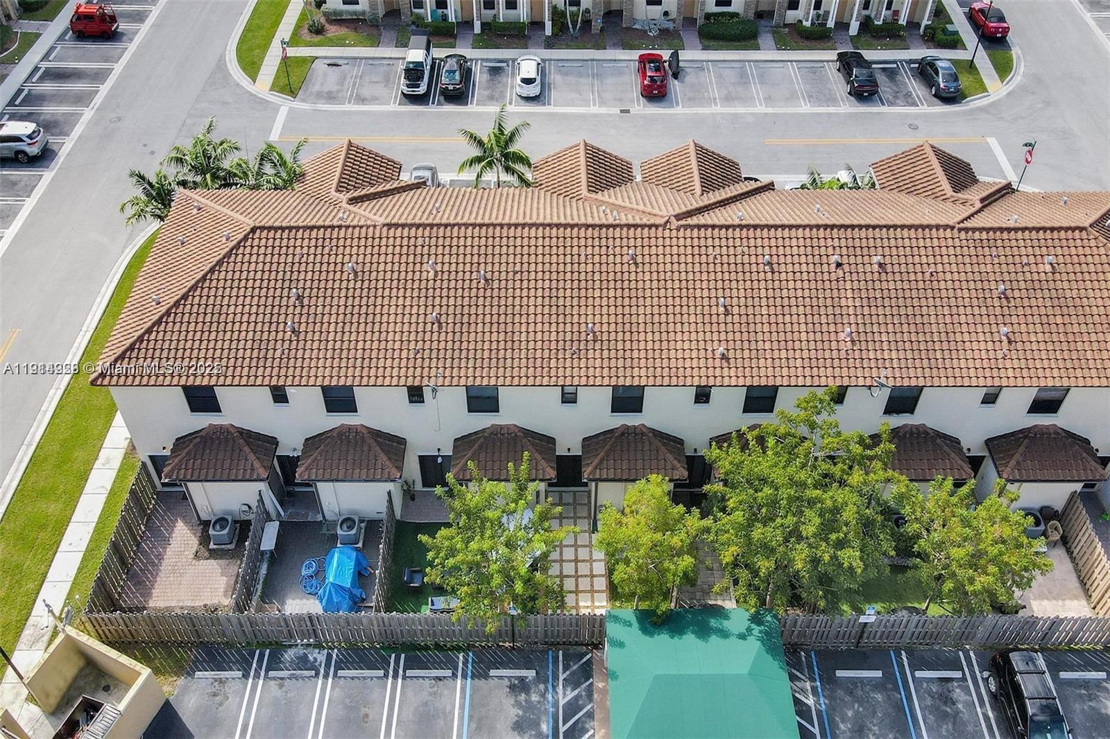 3217 Southeast 4th Street Homestead, FL 33033 - Photo 6 of 20 a view of a patio with table and chairs potted plants