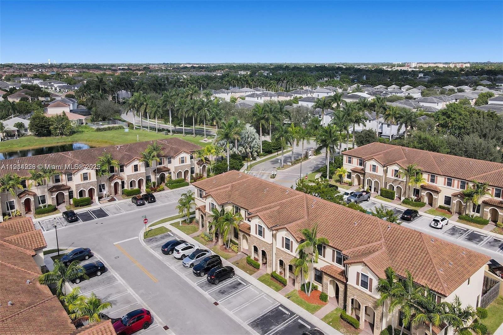 3217 Southeast 4th Street Homestead, FL 33033 - Photo 7 of 20 an aerial view of a city with lots of residential buildings ocean and mountain view in back