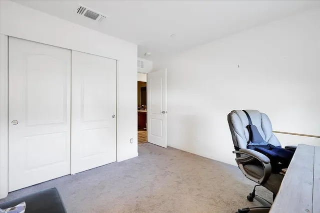 a view of workspace with furniture and wooden floor