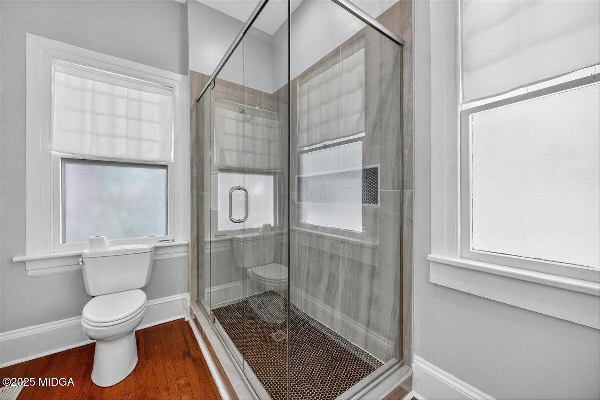 173 Pierce Avenue Macon, GA 31204 - Photo 12 of 20 a bathroom with a toilet and a shower