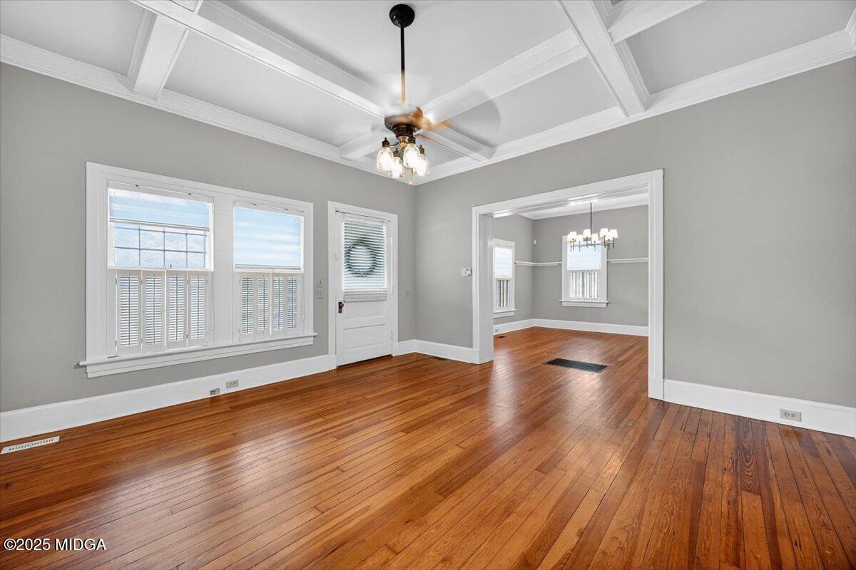 173 Pierce Avenue Macon, GA 31204 - Photo 4 of 20 a view of empty room with wooden floor and fan