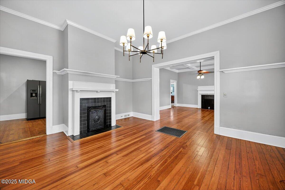 173 Pierce Avenue Macon, GA 31204 - Photo 6 of 20 a view of a livingroom with wooden floor and a fireplace