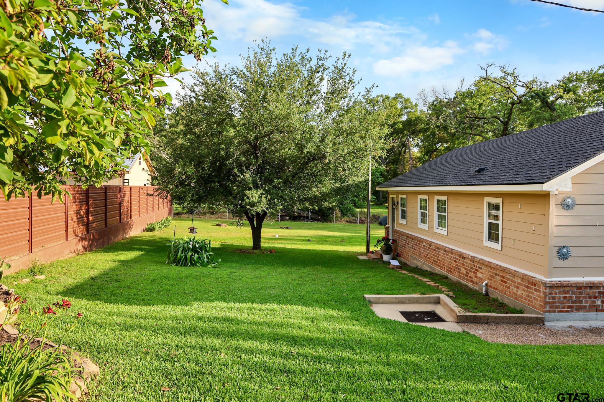 11931 State Highway 64 Tyler, TX 75704 - Photo 30 of 44 a view of a house with a backyard