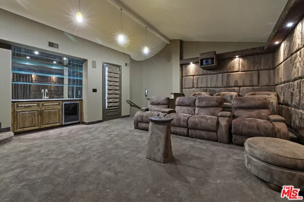 a bedroom with a bed and glass window