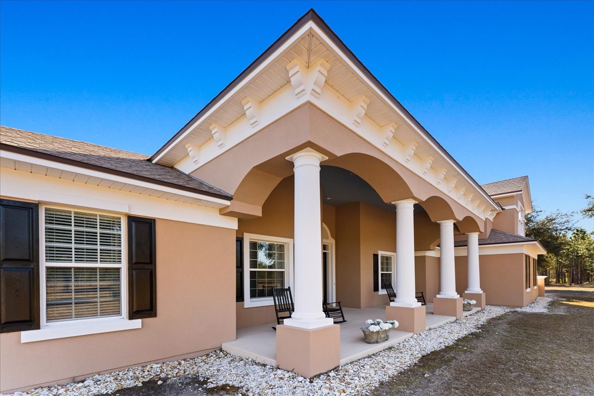 27247 Hallman Road Hilliard, FL 32046 - Photo 9 of 59 a front view of a house with a yard