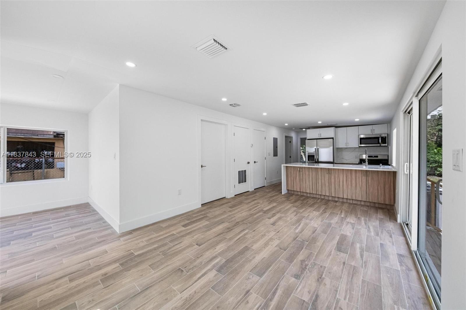 5900 Northwest 5th Court Miami, FL 33127 - Photo 13 of 35 a view of kitchen and wooden floor