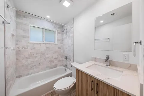 a bathroom with a sink a toilet and a bathtub