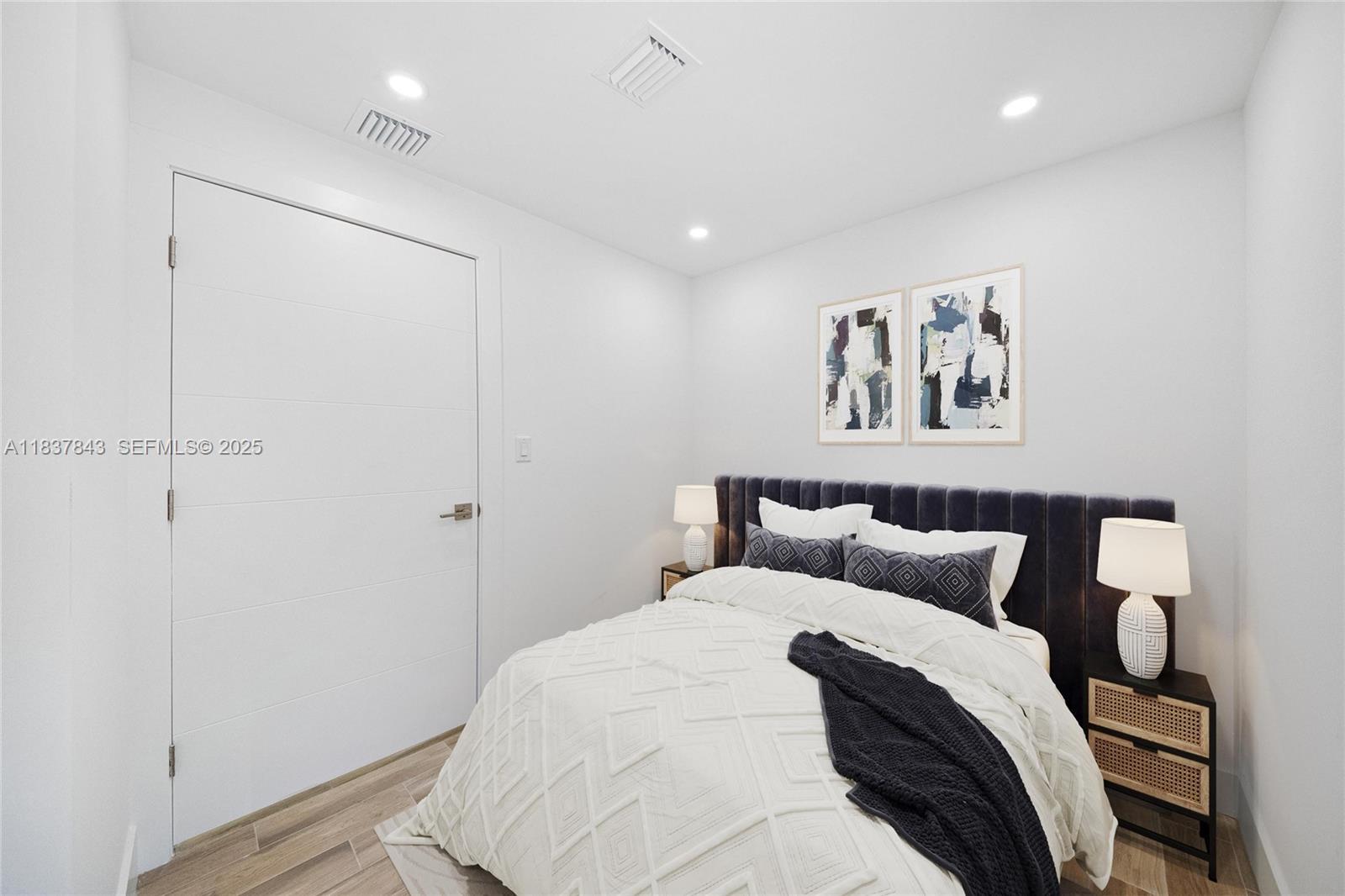 5900 Northwest 5th Court Miami, FL 33127 - Photo 20 of 35 a bedroom with a bed and painting on the wall
