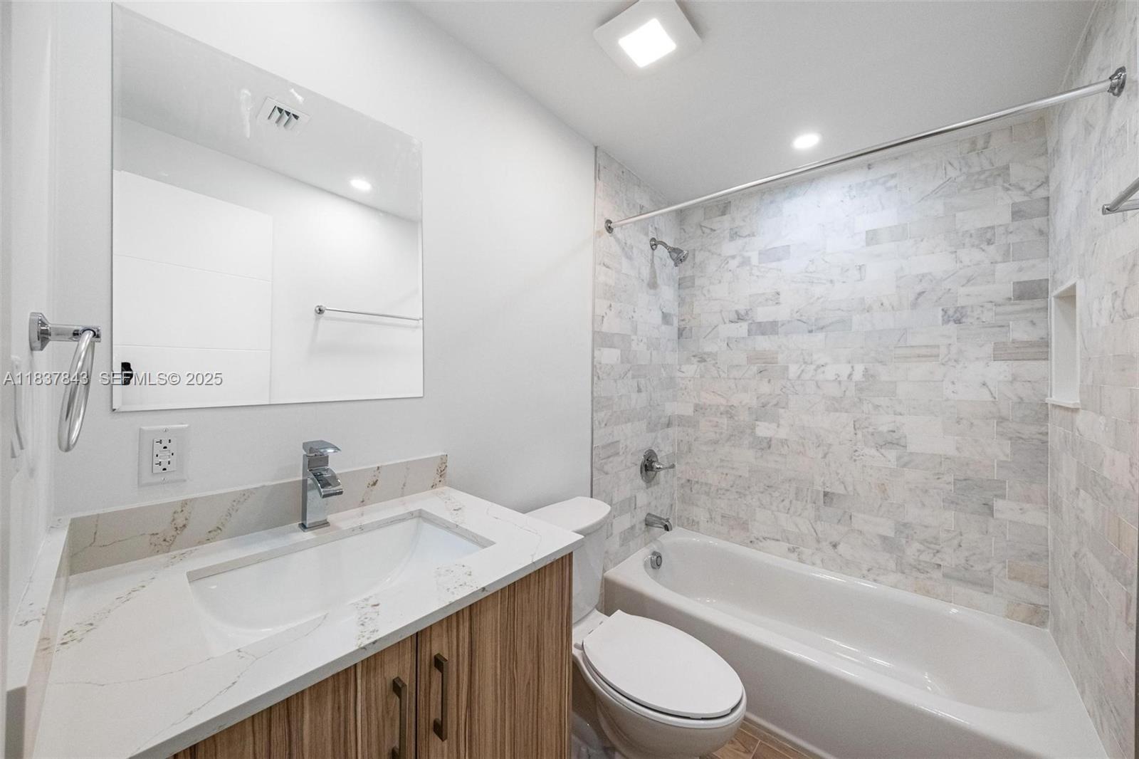 5900 Northwest 5th Court Miami, FL 33127 - Photo 21 of 35 a bathroom with a granite countertop sink toilet and shower