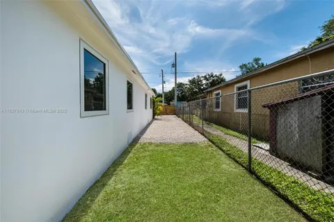 a view of a backyard with potted plants