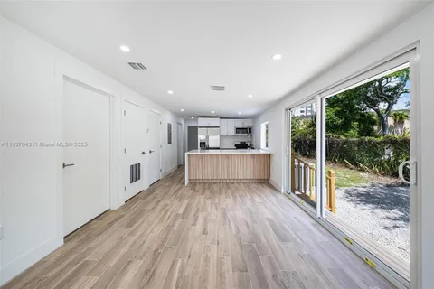 a view of a room with wooden floor and floors