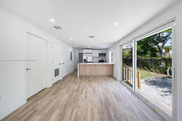 a view of a room with wooden floor and floors