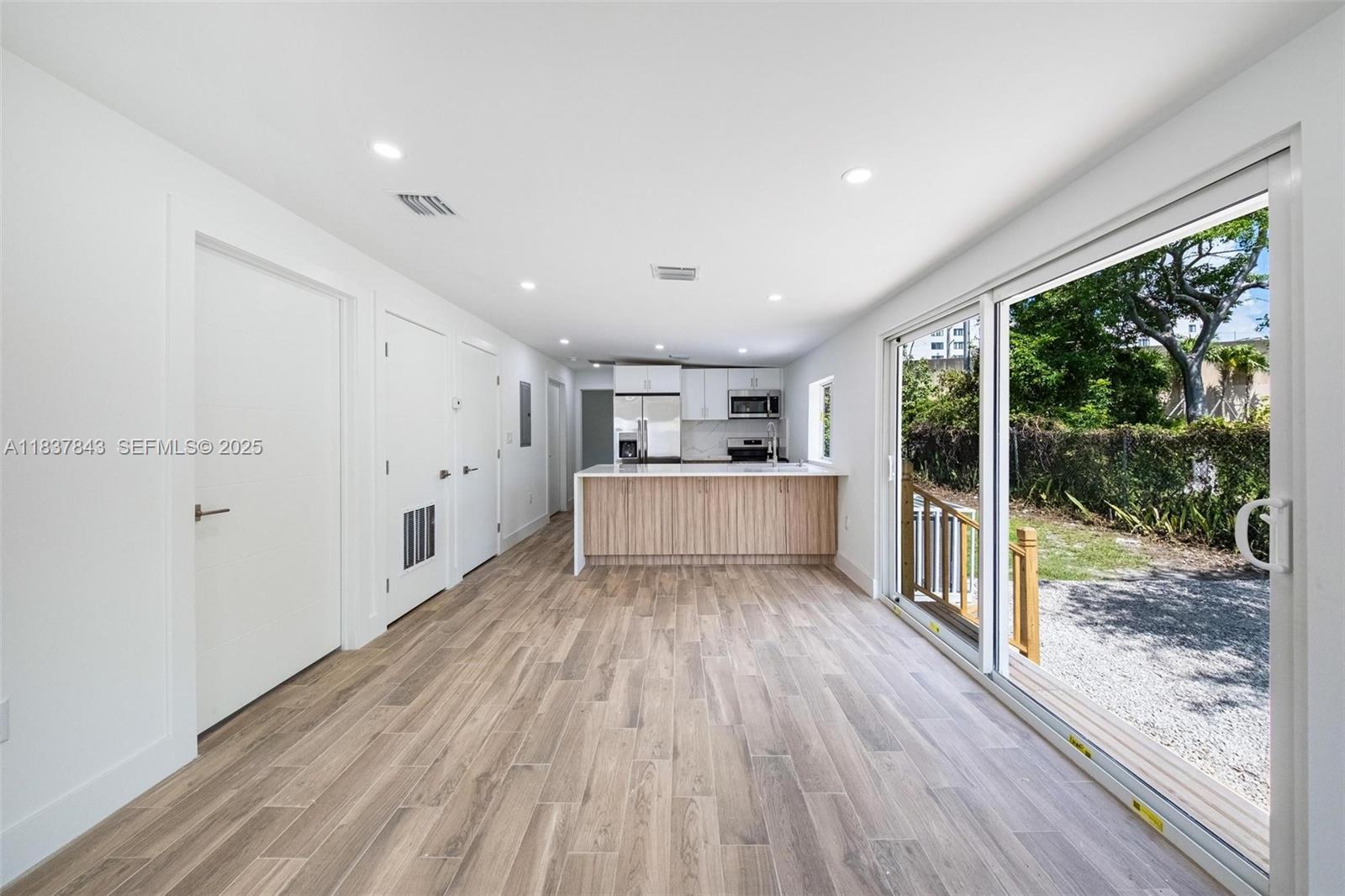 5900 Northwest 5th Court Miami, FL 33127 - Photo 8 of 35 a view of a room with wooden floor and floors