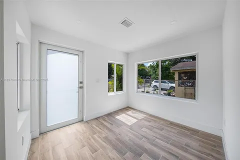 a view of livingroom with furniture wooden floor and window