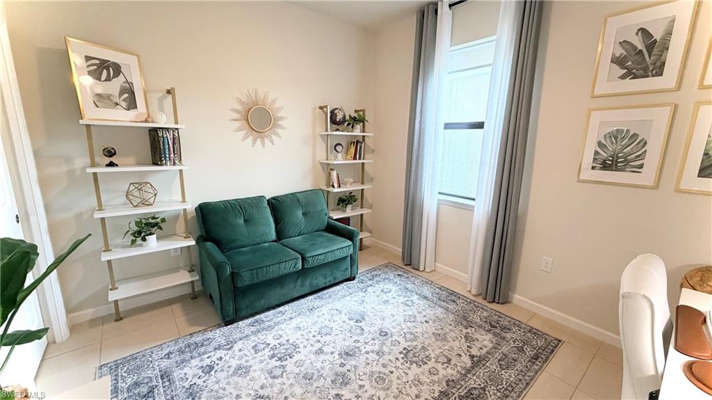 2085 Yellowfin Circle Naples, FL 34114 - Photo 14 of 50 a living room with furniture and a rug