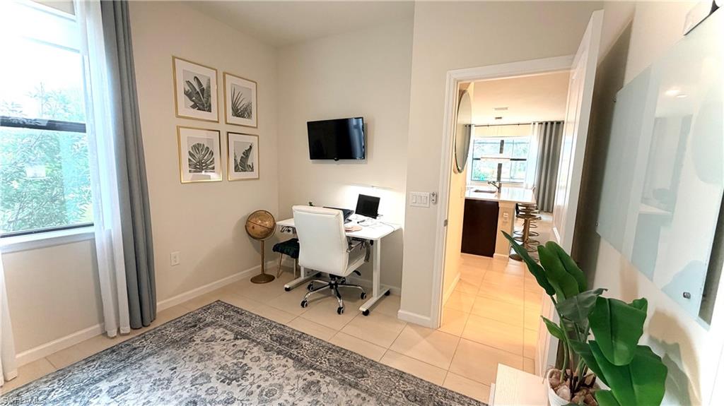 2085 Yellowfin Circle Naples, FL 34114 - Photo 16 of 50 a view of a workspace with furniture and a window