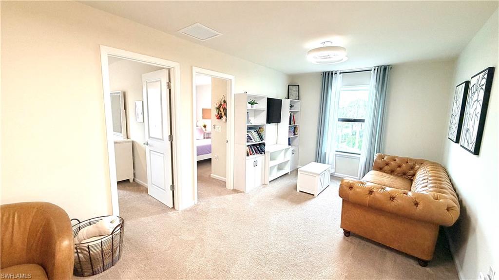 2085 Yellowfin Circle Naples, FL 34114 - Photo 18 of 50 a living room with furniture and a area