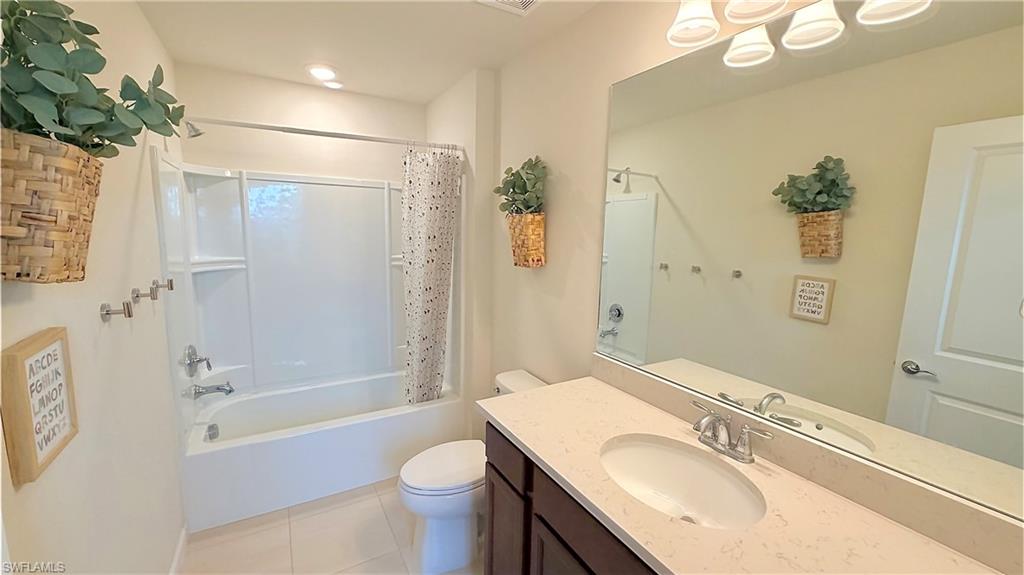2085 Yellowfin Circle Naples, FL 34114 - Photo 20 of 50 a bathroom with a sink toilet and shower