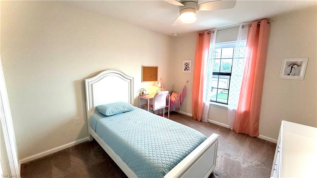2085 Yellowfin Circle Naples, FL 34114 - Photo 21 of 50 a bedroom with a bed and window