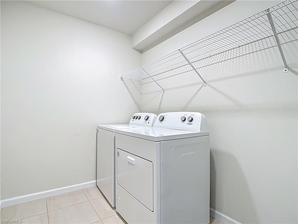 2085 Yellowfin Circle Naples, FL 34114 - Photo 28 of 50 a utility room with dryer and washer
