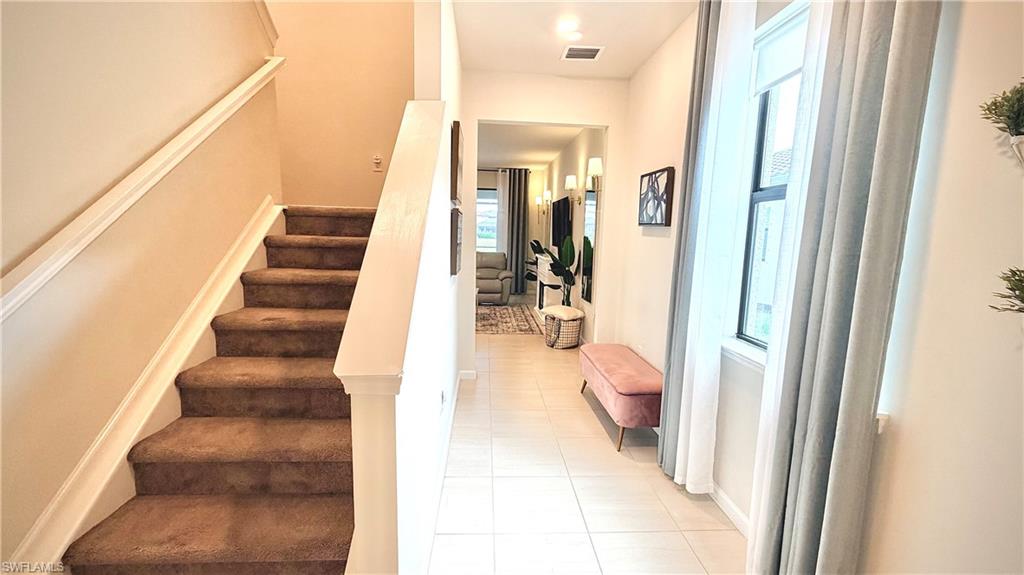 2085 Yellowfin Circle Naples, FL 34114 - Photo 3 of 50 a view of entryway and hall with wooden floor