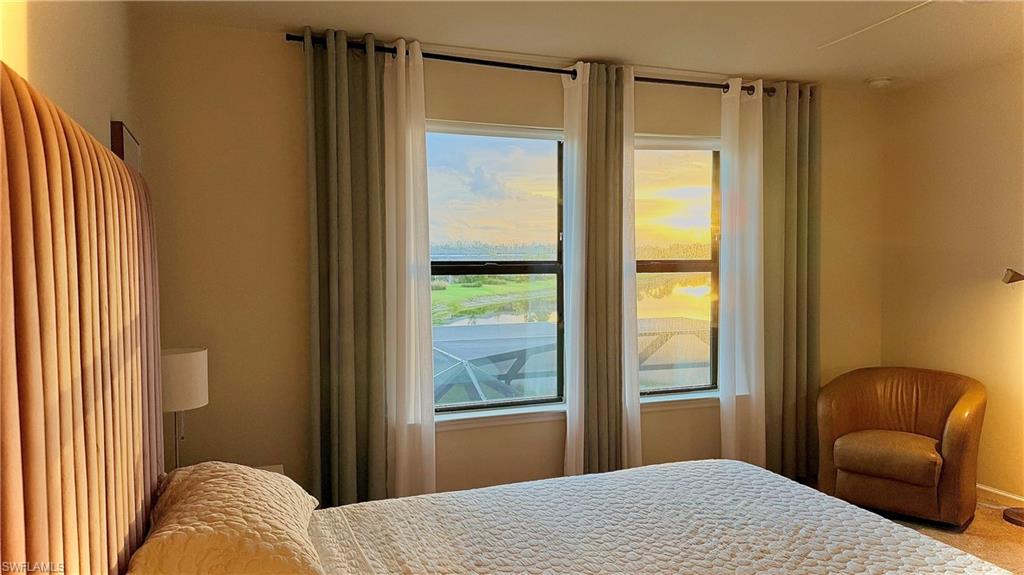 2085 Yellowfin Circle Naples, FL 34114 - Photo 29 of 50 a bedroom with a bed and a window