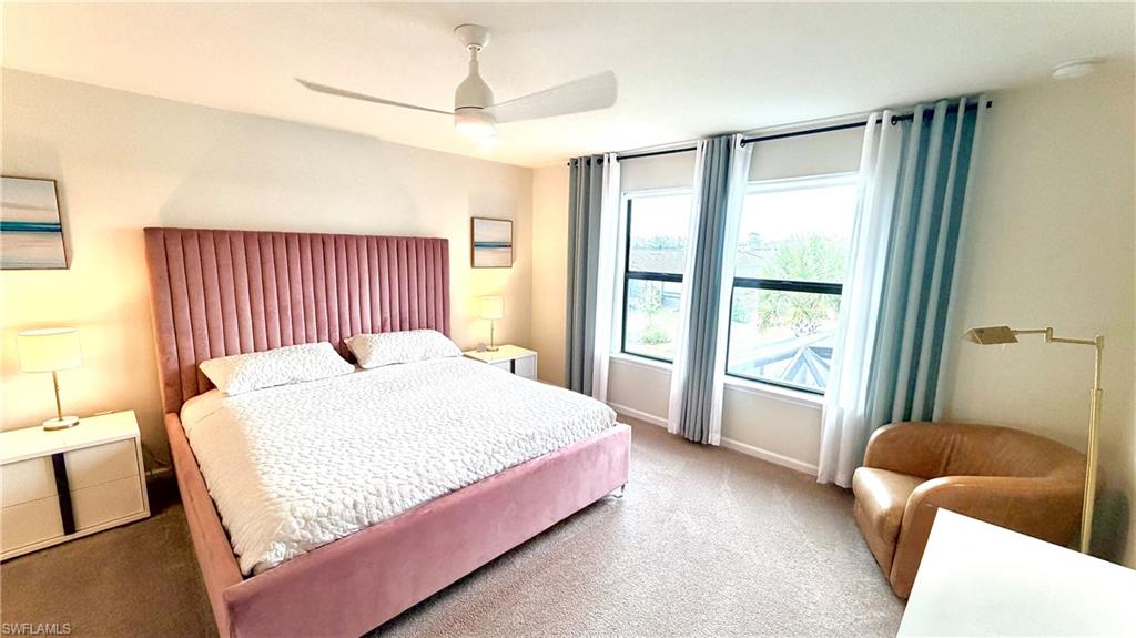 2085 Yellowfin Circle Naples, FL 34114 - Photo 30 of 50 a bedroom with a bed and a window