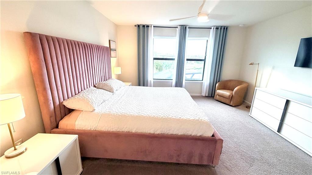 2085 Yellowfin Circle Naples, FL 34114 - Photo 31 of 50 a bedroom with a bed and a window