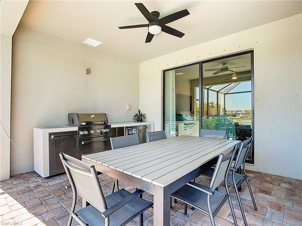 2085 Yellowfin Circle Naples, FL 34114 - Photo 37 of 50 a dining room with furniture and window
