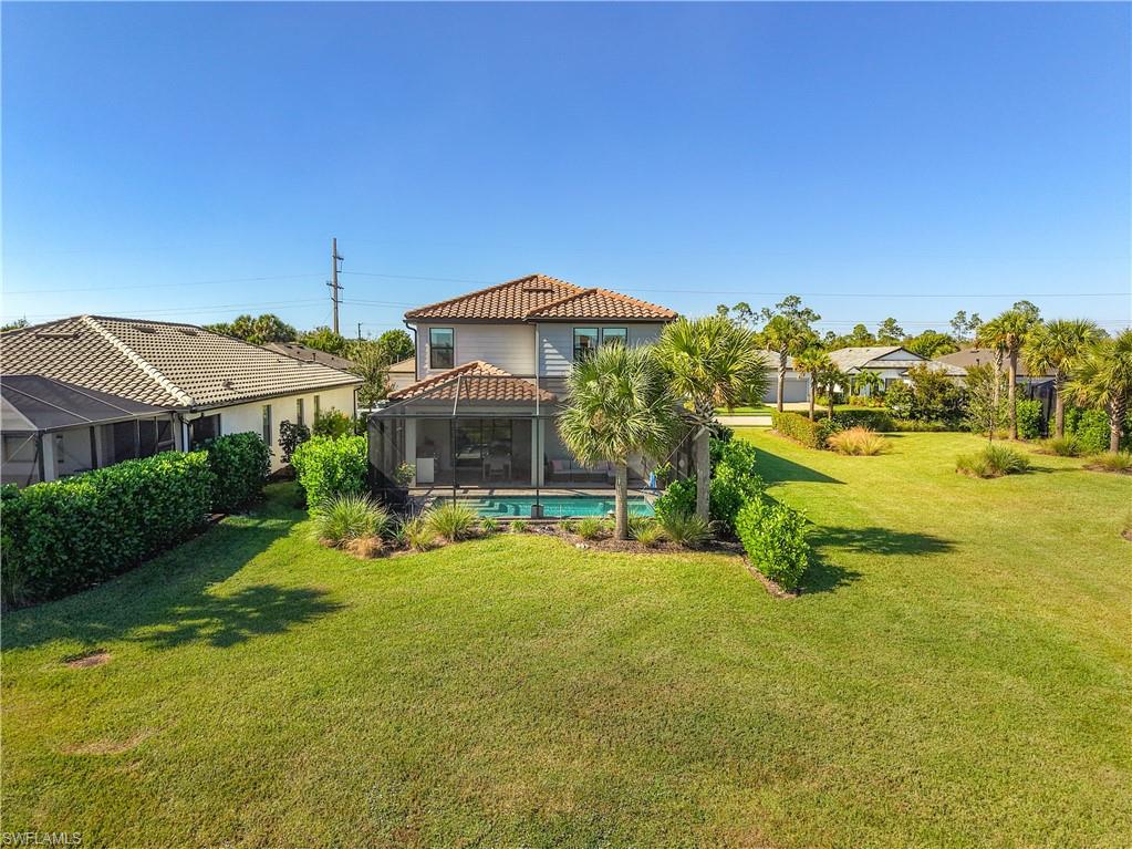 2085 Yellowfin Circle Naples, FL 34114 - Photo 41 of 50 a view of a house with a yard and sitting area