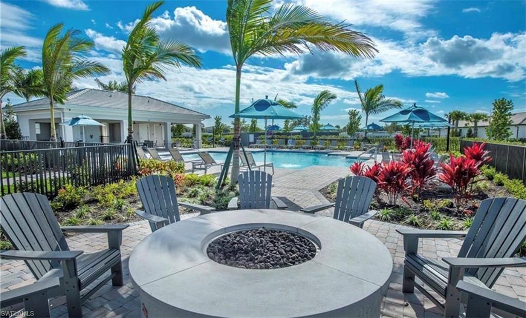 2085 Yellowfin Circle Naples, FL 34114 - Photo 44 of 50 a view of a chairs and table in patio