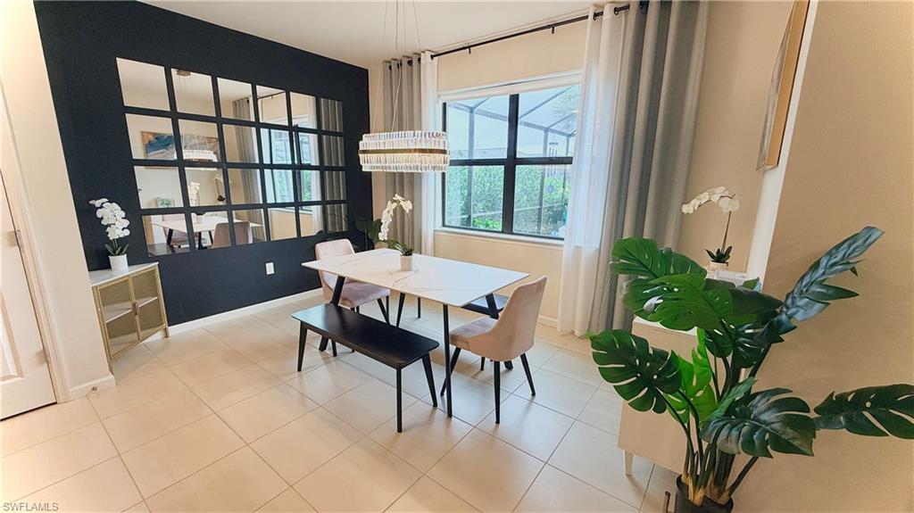2085 Yellowfin Circle Naples, FL 34114 - Photo 8 of 50 a view of a dining room with furniture window and wooden floor