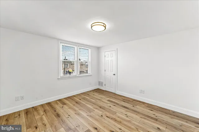 a bathroom with a sink toilet and mirror