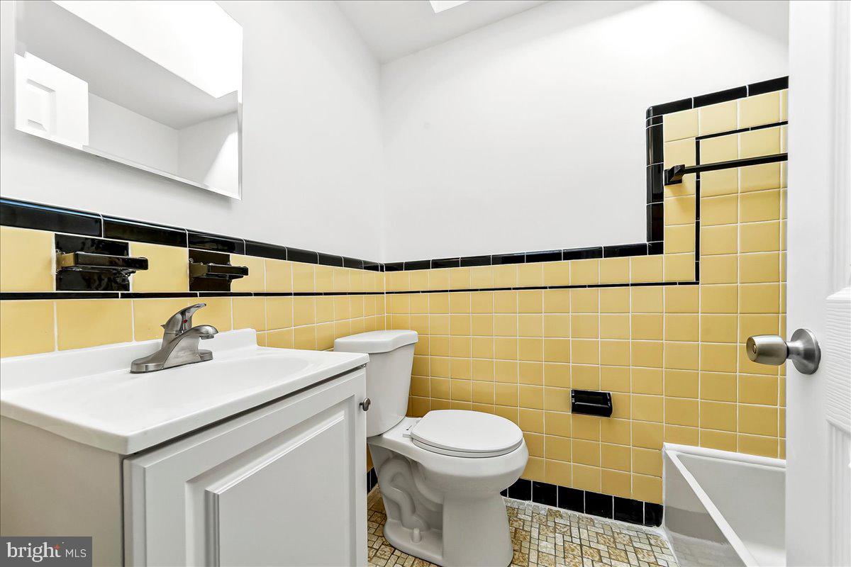 1232 Edgehill Road Darby, PA 19023 - Photo 12 of 20 a bathroom with a sink toilet and mirror