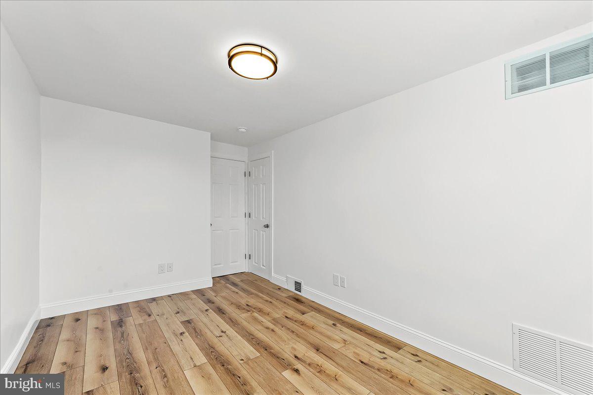 1232 Edgehill Road Darby, PA 19023 - Photo 14 of 20 a view of a room with wooden floor and white walls